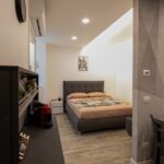 Small modern bedroom with cozy decor.