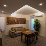 Modern living room with dining table setup.