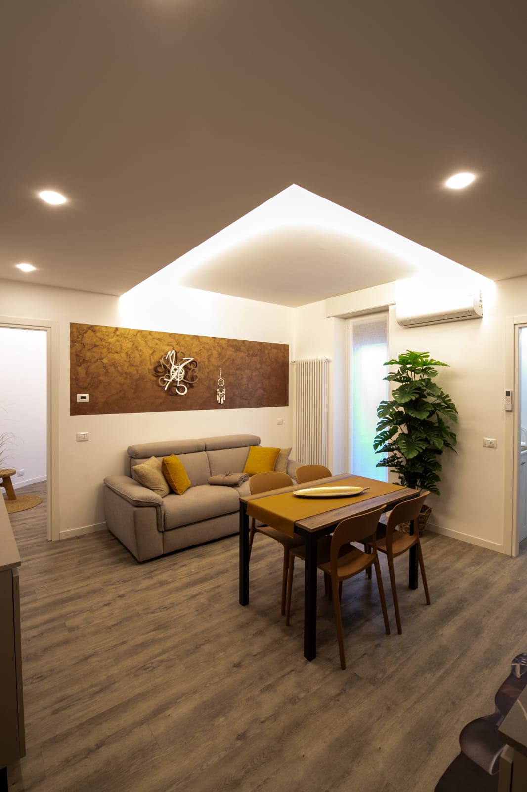 Modern living room with dining table setup.