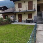 Two-story house with a front yard.