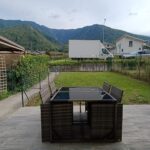 Patio furniture with mountain view background.