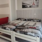 Two single beds in a modern room.