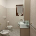 Small bathroom with toilet and sink.